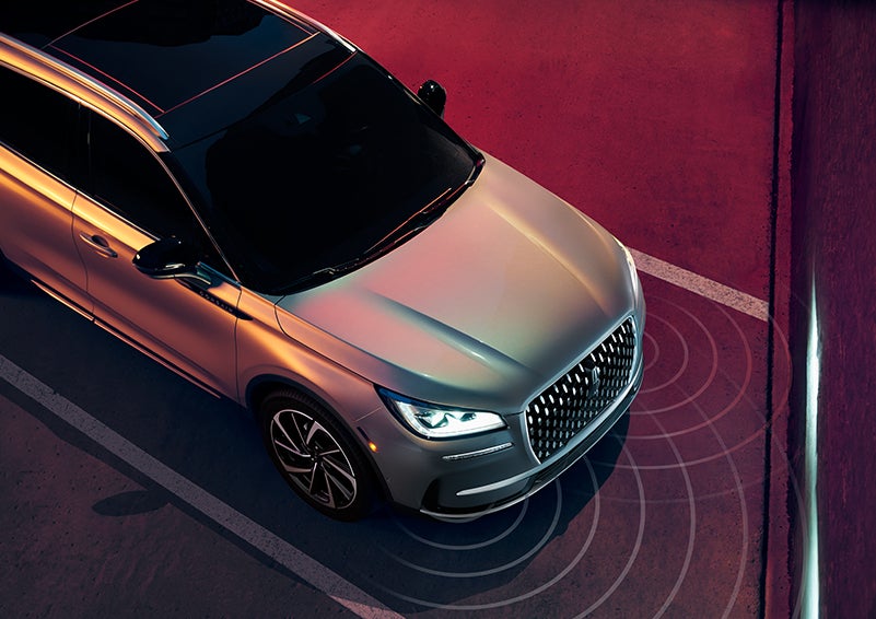 Illustrated radar signals are shown emitting from the front of a 2023 Lincoln Corsair® SUV. | Libertyville Lincoln Sales, Inc. in Libertyville IL