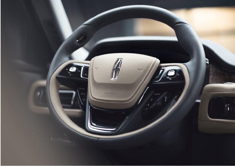 The intuitively placed controls of the steering wheel on a 2023 Lincoln Aviator® SUV | Libertyville Lincoln Sales, Inc. in Libertyville IL