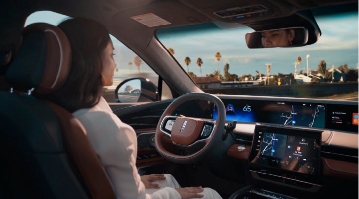 A person is shown driving hands-free on the highway with available Lincoln BlueCruise technology. | Libertyville Lincoln Sales, Inc. in Libertyville IL