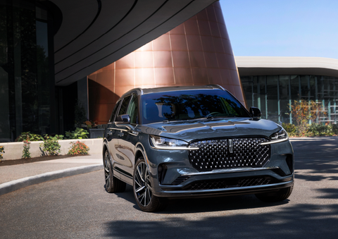 A gray 2025 Lincoln Aviator® SUV is parked outside a modern building with the sun shining. | Libertyville Lincoln Sales, Inc. in Libertyville IL
