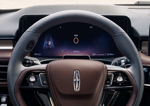 The steering wheel of 2025 Lincoln Aviator® SUV is shown with black and brown accents. | Libertyville Lincoln Sales, Inc. in Libertyville IL