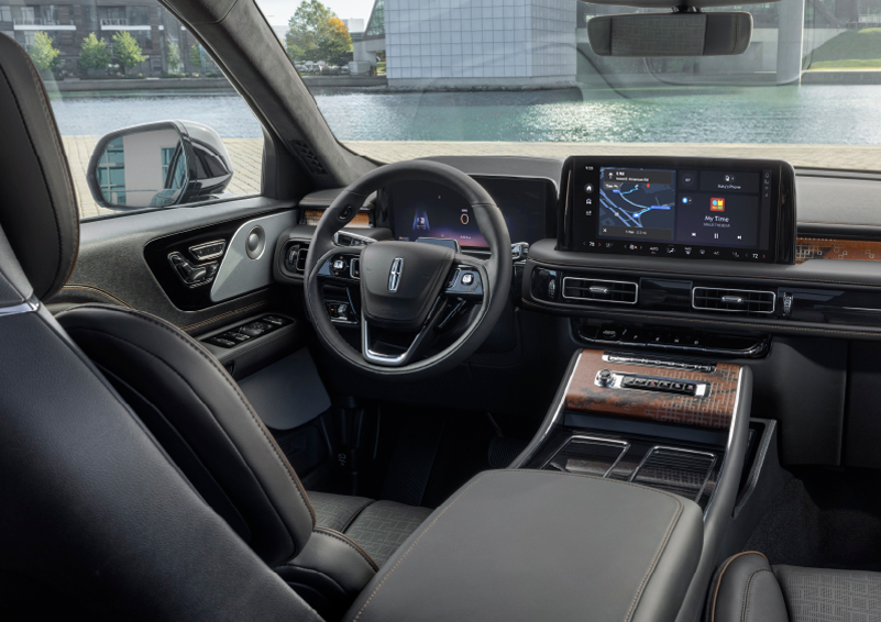 The interior of the 2025 Lincoln Aviator® SUV is shown parked with a view of a harbor through the windshield. | Libertyville Lincoln Sales, Inc. in Libertyville IL