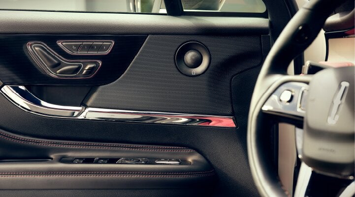 A Revel® audio speaker is shown in the driver's side door of a 2025 Lincoln Corsair® SUV. | Libertyville Lincoln Sales, Inc. in Libertyville IL