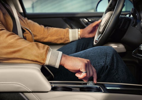 The driver of a 2024 Lincoln Corsair® SUV is shown selecting the drive mode. | Libertyville Lincoln Sales, Inc. in Libertyville IL