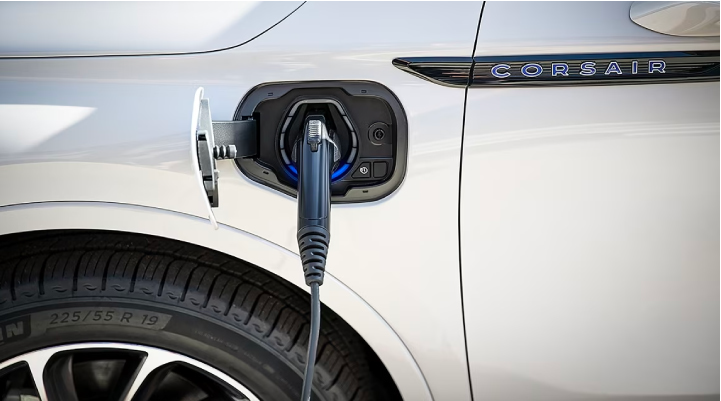 An electric charger is shown plugged into the charging port of a Lincoln Corsair® Grand Touring
model. | Libertyville Lincoln Sales, Inc. in Libertyville IL