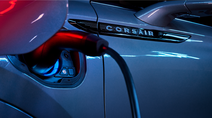 A charger plugged into the charging port of a 2025 Lincoln Corsair® Plug-in Hybrid model. | Libertyville Lincoln Sales, Inc. in Libertyville IL