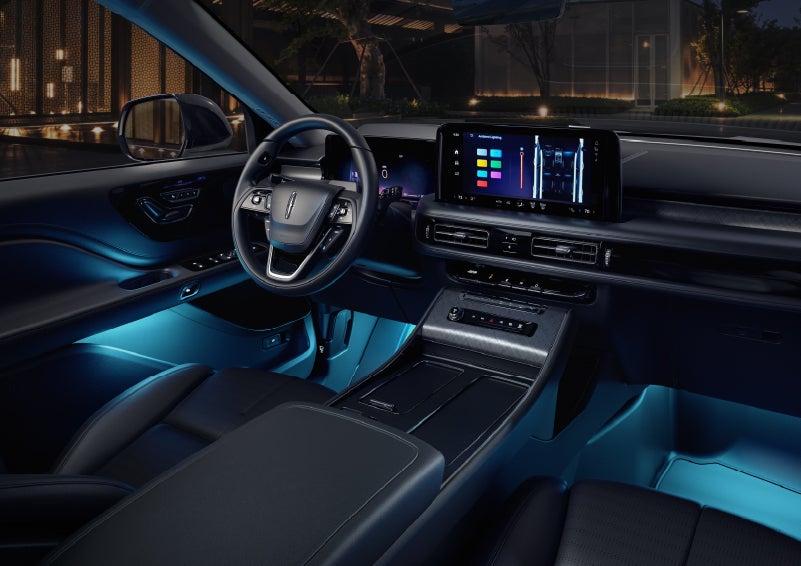 Deep blue ambient lighting glows from various places within a 2026 Lincoln Aviator® SUV. | Libertyville Lincoln Sales, Inc. in Libertyville IL