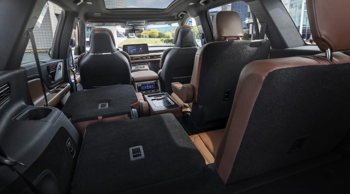 One side of the PowerFold® third-row seat and a second-row seat are folded forward in the 2026 Lincoln Aviator® SUV. | Libertyville Lincoln Sales, Inc. in Libertyville IL