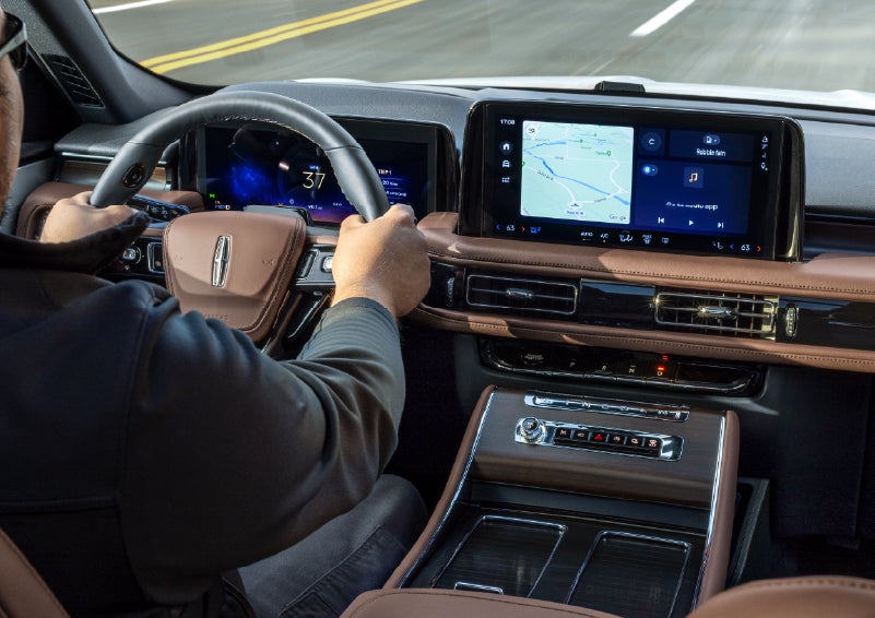 A person is driving a 2026 Lincoln Aviator® SUV as seen from inside the cabin. | Libertyville Lincoln Sales, Inc. in Libertyville IL