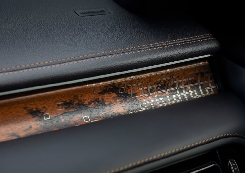 A close-up shot of the 2026 Lincoln Aviator® dashboard with unique black and brown accents and brown stitching. | Libertyville Lincoln Sales, Inc. in Libertyville IL