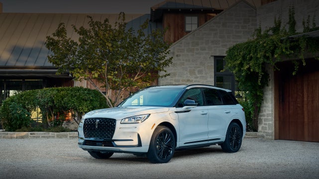 A 2026 Lincoln Corsair® SUV is parked in front off a luxury home. | Libertyville Lincoln Sales, Inc. in Libertyville IL