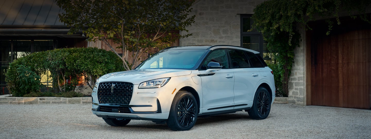 A 2026 Lincoln Corsair® SUV is parked in front off a luxury home. | Libertyville Lincoln Sales, Inc. in Libertyville IL