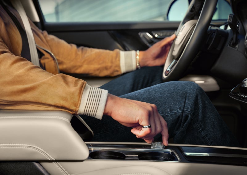 The driver of a 2026 Lincoln Corsair® SUV is shown selecting a drive mode. | Libertyville Lincoln Sales, Inc. in Libertyville IL