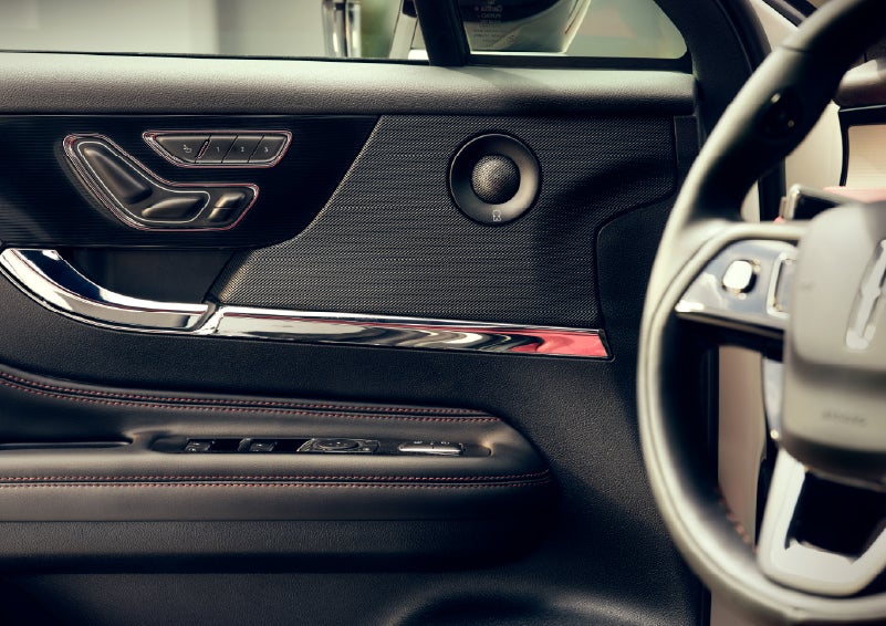 An audio speaker is shown in the driver's side door of a 2026 Lincoln Corsair® SUV | Libertyville Lincoln Sales, Inc. in Libertyville IL