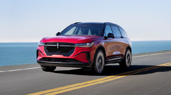 A 2026 Lincoln Nautilus® SUV is being driven on a seaside roadway. | Libertyville Lincoln Sales, Inc. in Libertyville IL