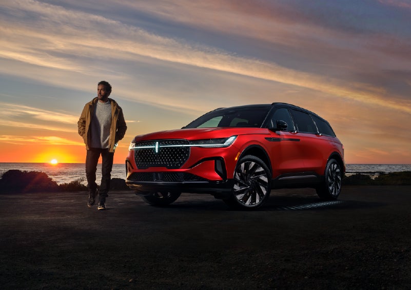A person is shown next to a 2026 Lincoln Nautilus® SUV as the Lincoln Embrace sequence takes place. | Libertyville Lincoln Sales, Inc. in Libertyville IL