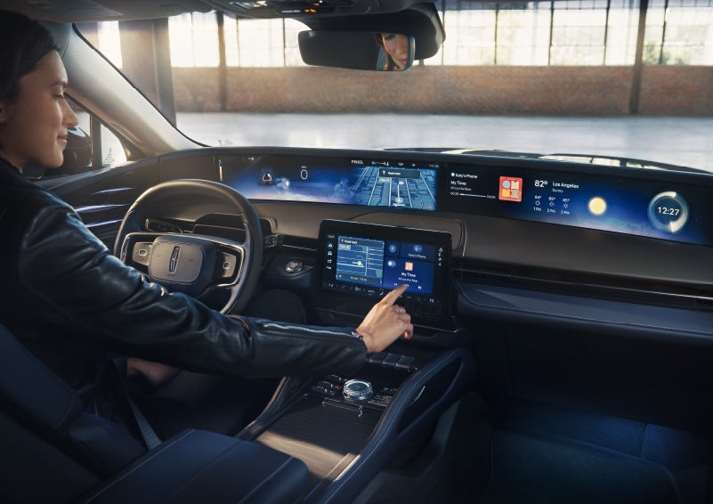 The driver of a 2026 Lincoln Nautilus® SUV interacts with the center touchscreen. | Libertyville Lincoln Sales, Inc. in Libertyville IL