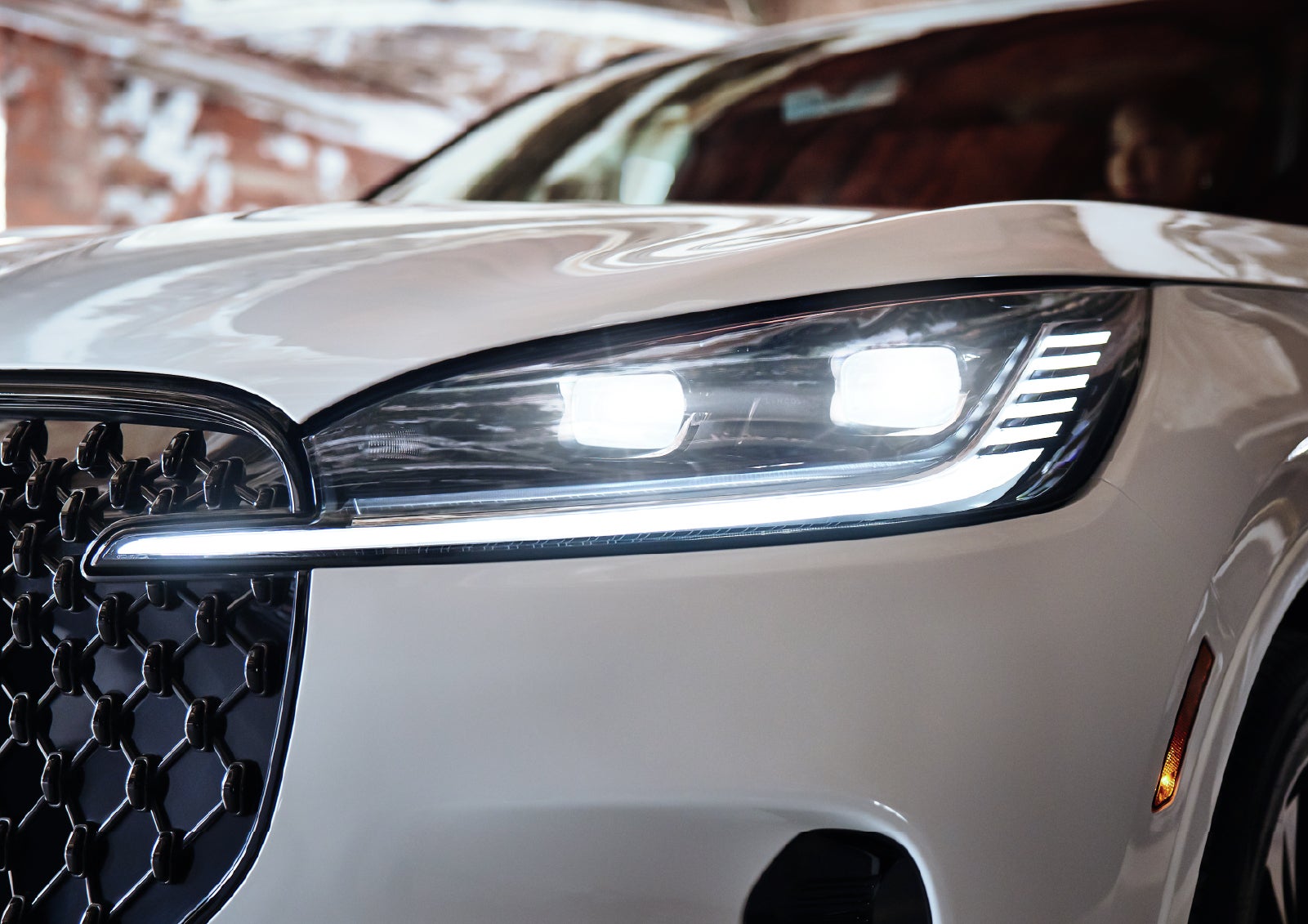 A close-up of a headlamp on the 2027 Lincoln Aviator® SUV is shown. | Libertyville Lincoln Sales, Inc. in Libertyville IL