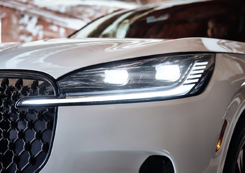 A close-up of a headlamp on the 2027 Lincoln Aviator® SUV is shown. | Libertyville Lincoln Sales, Inc. in Libertyville IL