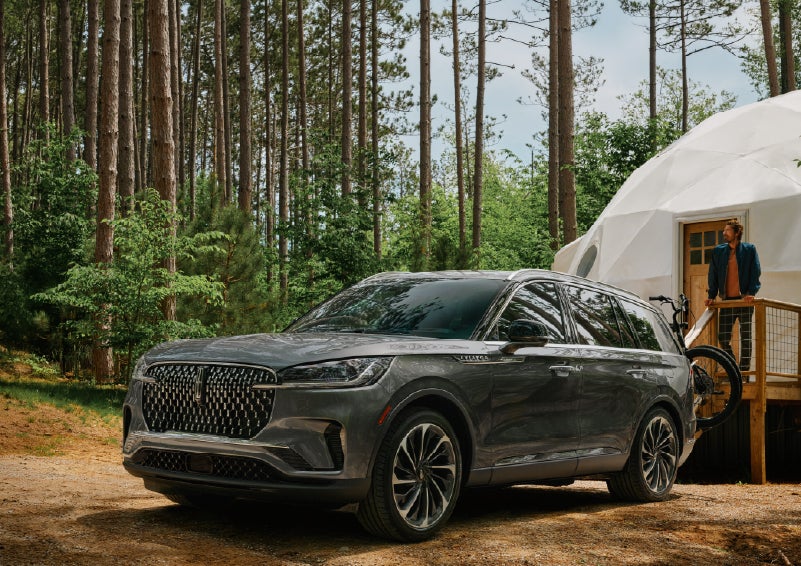 A 2027 Lincoln Aviator® is parked next to a high end glamping site. | Libertyville Lincoln Sales, Inc. in Libertyville IL