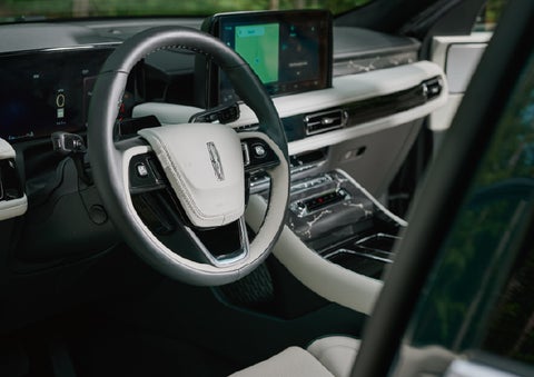The leather-trimmed steering wheel of a 2027 Lincoln Aviator® Black Label™ SUV. | Libertyville Lincoln Sales, Inc. in Libertyville IL