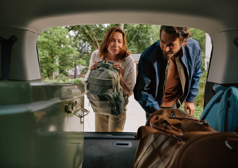 A couple loads luggage into the rear of a 2027 Lincoln Aviator® Black Label™ SUV..e 202 | Libertyville Lincoln Sales, Inc. in Libertyville IL